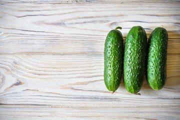 Fresh organic cucumber on the wooden table