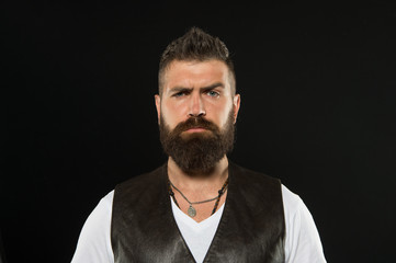 His bushy mustache is great. Serious guy wearing beard and mustache on black background. Bearded...
