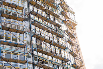 construction of a high-rise building, scaffolding