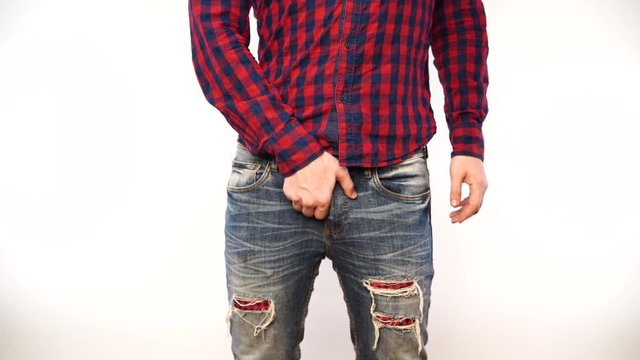 Man scratching crotch on white background, closeup. Annoying itch