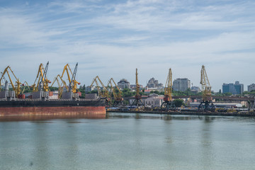 Obraz premium Odessa, Ukraine- June 17, 2019: Sea cargo port with cargo ships and cranes for unloading.