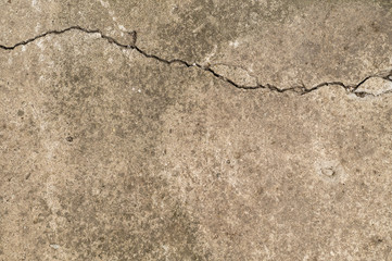 Concrete surface, textured with a crack horizontally.