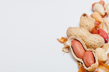 Large peeled peanuts close-up of beans in the shell. Unpeeled peanuts in the shell. Peanuts, for background or texture. Growing organic protein