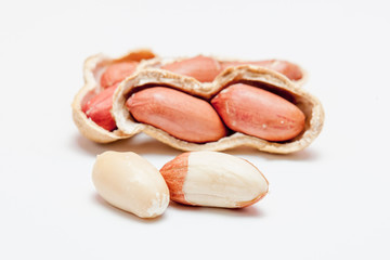 Large peeled peanuts close-up of beans in the shell. Unpeeled peanuts in the shell. Peanuts, for background or texture. Growing organic protein