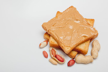 Peanut butter sandwiches or toasts on white background