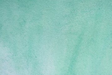 green aquamarine watercolor background, sheet of paper covered with paint with texture