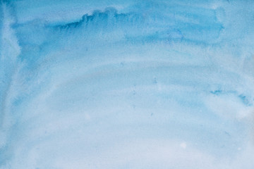 Obraz premium blue watercolor background, sheet of paper covered with paint with texture