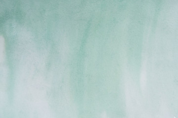 Fototapeta premium green watercolor background, sheet of paper covered with paint with texture