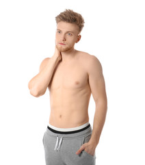 Fototapeta premium Portrait of young man with slim body on white background