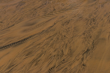 close up on wet beach sand texture