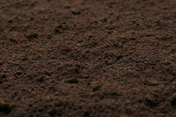 Textured ground surface as background, closeup. Fertile soil