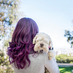 woman violet hair with dog