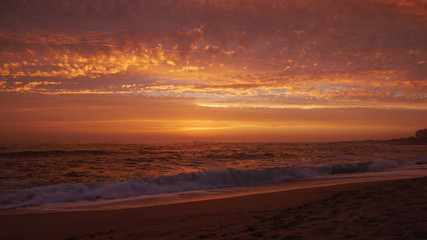 Fototapeta na wymiar Wide angle view over beach at sunset in Portugal with beautiful clouds