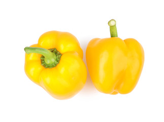 Ripe yellow bell peppers isolated on white, top view