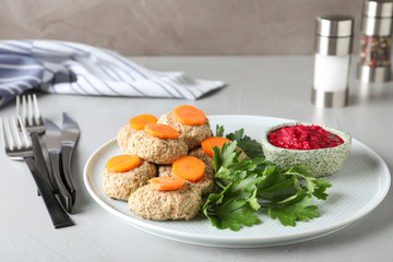 Plate of traditional Passover (Pesach) gefilte fish on table