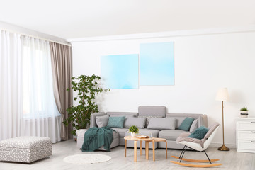 Modern living room interior with comfortable sofa