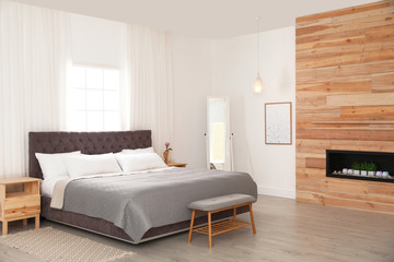 Fototapeta na wymiar Modern comfortable bed in room. Interior design