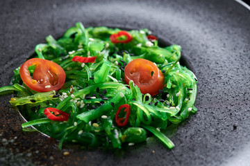 Chuk salad on a black plate