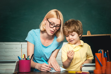 Kids from primary school. Hard exam. Child from elementary school with book. Educational process....