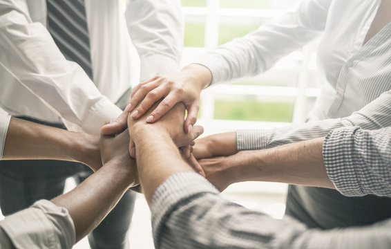Stack of hands. Unity and teamwork concept.