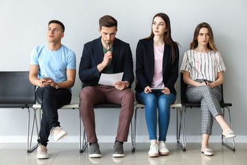 Obraz premium Young people waiting for job interview indoors