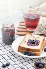 Fresh blueberries, blueberry juice, blueberry jam and bread