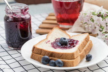 Fresh blueberries, blueberry juice, blueberry jam and bread
