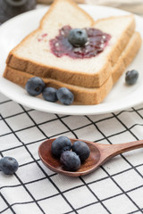 Fresh blueberries, blueberry juice, blueberry jam and bread