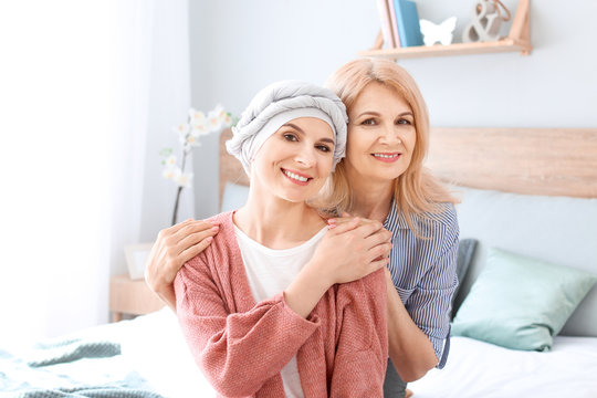 Woman after chemotherapy with her mother at home
