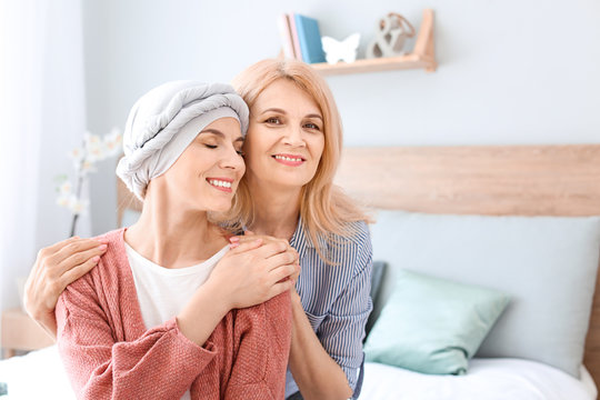Woman after chemotherapy with her mother at home