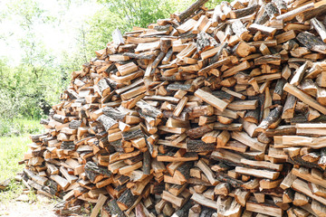 Pile of chopped fire wood prepared for winter outdoors