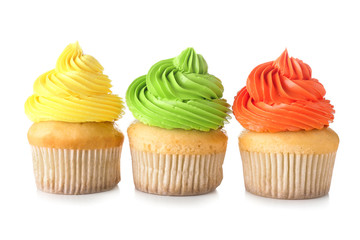 Sweet tasty cupcakes on white background