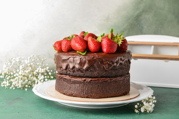 Plate with tasty chocolate cake on table