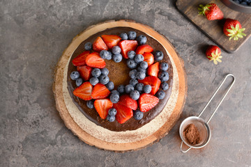 Tasty chocolate cake on grey table
