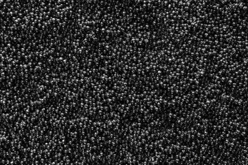 Many black caviar as background