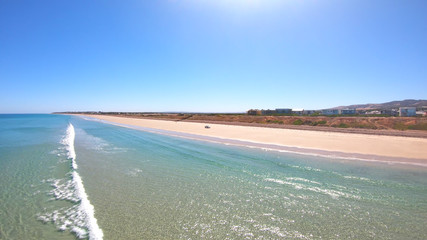 Drone aerial view of Australian wide open beach and coastline, taken at Sellicks Beach, South Australia.