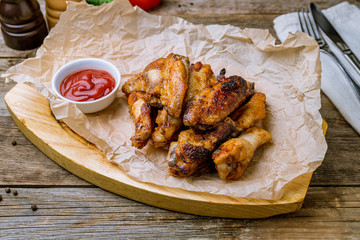Buffalo chicken wings on wooden board
