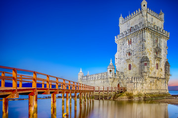 Fototapeta na wymiar Ancient Belem Tower on Tagus River in Lisbon at Blue Hour in Portugal.