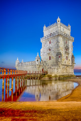 Ancient Belem Tower on Tagus River in Lisbon at Blue Hour in Portugal.