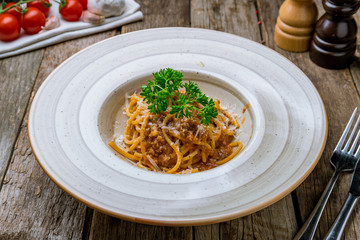 Pasta spaghetti Bolognese on wooden background