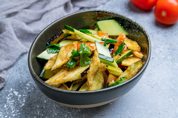 Salad with baked aubergines and vegetables