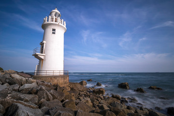 lighthouse on coast of sea