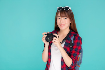 Beautiful young asian woman smiling is journalist photographer wear fashion travel summer, girl holding camera hobby tourist and trip in vacation and holiday isolated on blue background.