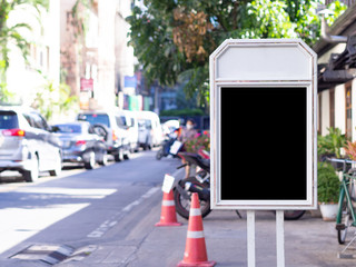 Signboard laying on the side of the road. Space for text