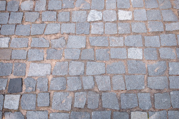 Paving road lined with gray stones