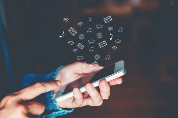 Businessman using mobile online icon social networking connection on screen