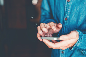Businessman using mobile online icon social networking connection on screen