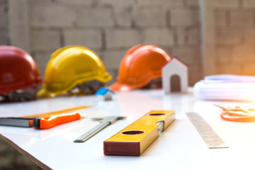 Desk of Architectural working project in construction site,With drawing equipment.Architectural concept