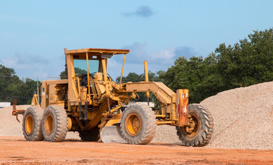 Motor Grader bulldozer heavy equipment at a construction site. - 274804466