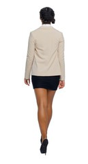 Fototapeta premium Back view of a black African-American in a suit that goes with his hand.